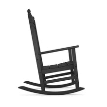 Black rocking chair, angled side view with slatted seat and curved rockers