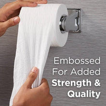 Embossed 2-ply toilet paper on a wall-mounted dispenser, tissue pulled outward