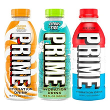 Three PRIME hydration drink bottles: orange, citrus, and ice pop flavors.