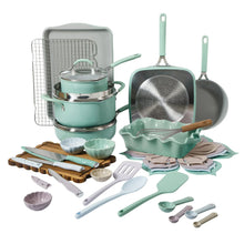 Mint green ceramic nonstick cookware set with pots, pan, and kitchen tools