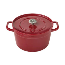 Red enamel cast iron Dutch oven with lid, round handles and knob on top