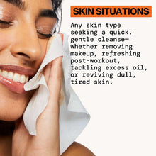 Glowing makeup removing wipes applied with white wipe on cheek, smile visible