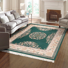 Hand-knotted green rug with floral medallion and ornate border, white fringe