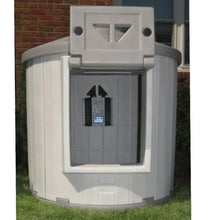 Gray dog house heater control box mounted on the kennel front panel