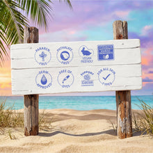 Tahitian vanilla body lotion benefit icons on a white wooden sign