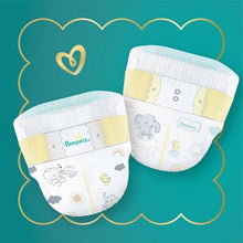 Two Swaddlers Ultra diapers illustration with tabs and light blue trim