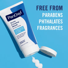 Acne creamy wash tube with open cap and a small white cream dollop