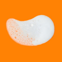 White foaming wash lather with small bubbles on a thick dollop