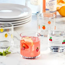 Set of 4 clear icon tumblers with fruit icons; one glass shows pink beverage