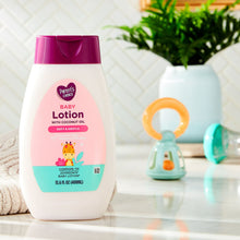 Baby lotion bottle with coconut oil, purple cap, on bathroom counter