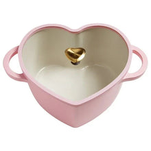 Pink heart-shaped Dutch oven with lid, cream interior and gold heart knob