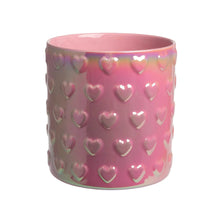 Pink iridescent ceramic utensil crock with embossed heart pattern and wide open top