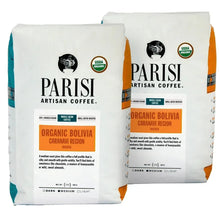 Two organic coffee bags, PARISI logo and orange Bolivia region label, whole bean
