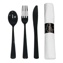 Black cutlery set with white napkin roll, including spoon, fork, and knife