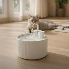 Ceramic-style pet water fountain with faucet stream in a white ribbed bowl