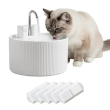 Ceramic-style pet water fountain with faucet, white ribbed base, and filter pads