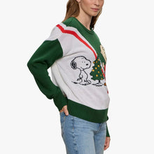 Women's green holiday sweater side view with Snoopy and Christmas tree motif
