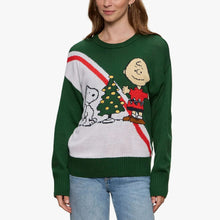 Women's green holiday sweater front with Snoopy, Charlie Brown, and tree graphic
