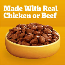 Bowl of brown soft wet dog food with gravy and visible meat pieces