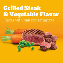 Grilled steak and vegetable flavor dog food pieces with carrots and peas
