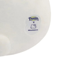 White bunny plush toy with Peep x Hello Kitty brand patch on side