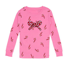 Kids holiday pajama top in pink with candy-cane prints and bow graphic; long sleeves
