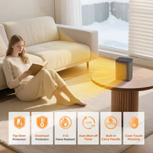 Black tabletop ceramic heater beside a sofa with safety feature panels