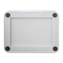 Underside view of white plastic desktop organizer with four corner pads