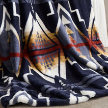 Pendleton faux fur blanket close-up showing its plush pile and navy geometric pattern