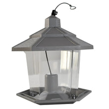 Gray plastic hopper wild bird feeder with clear viewing sides and feeding tray