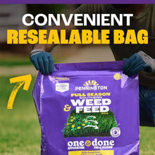 Purple weed and feed bag held by gloved hands, Pennington Full Season Southern