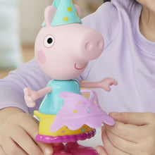 Peppa Pig pig figure wearing teal outfit with purple skirt, plus extra dress piece