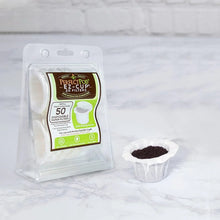 Pack of Perfect Pod EZ-Cup 2.0 paper filters with coffee grounds in one cup