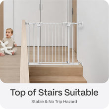 White baby gate installed at top of stairs with stable, flat barrier