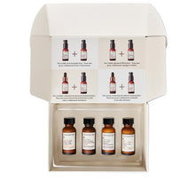 Serum collection set in open box with four amber bottles