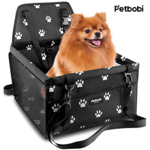 Black dog car booster seat travel carrier with paw print fabric and side straps
