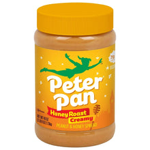 Peanut butter jar with yellow lid, creamy honey roast peanut spread