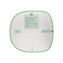 White cat litter pad with green border, rounded shape, and left/right marker labels