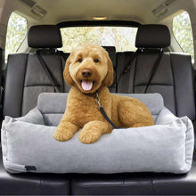 Car pet bed with bolstered sides, light gray fabric; tan dog lying inside