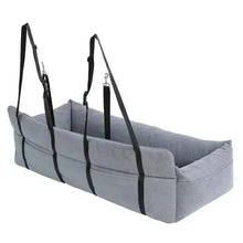 Car pet bed with light gray cushion and four black securing straps