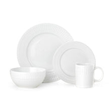 Porcelain dinnerware set in white with textured rims, including plate, bowl, and mug