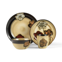 Stoneware dinner plate with black rim and painted poppy flowers in warm tones