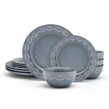 Blue stoneware dinnerware set with white lace trim plates and a matching bowl