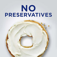 Cream cheese spread on a bagel, thick white swirl