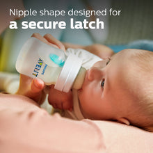 Philips Avent anti-colic baby bottle with Flow 1 nipple during feeding, clear bottle