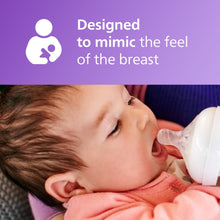 Baby drinking from a Natural baby bottle with first flow nipple