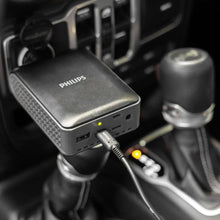 Car power inverter connected in vehicle, black unit with indicator light and USB port