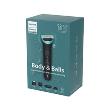 Body groomer kit box with black-and-teal trimmer handle and grooming heads