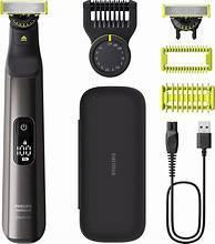 Philips Norelco OneBlade Pro trimmer kit with base, adapter cord, and blade guards