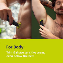 Trimmer grooming chest or body hair with black and yellow blade guard